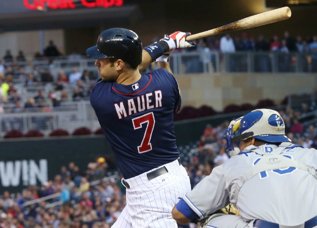 Joe Mauer hits a two-run double in the fourth inning. (Jim Mone/AP)